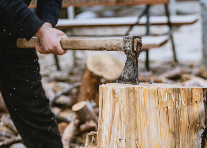 Axe splitting firewood for camping and survival
