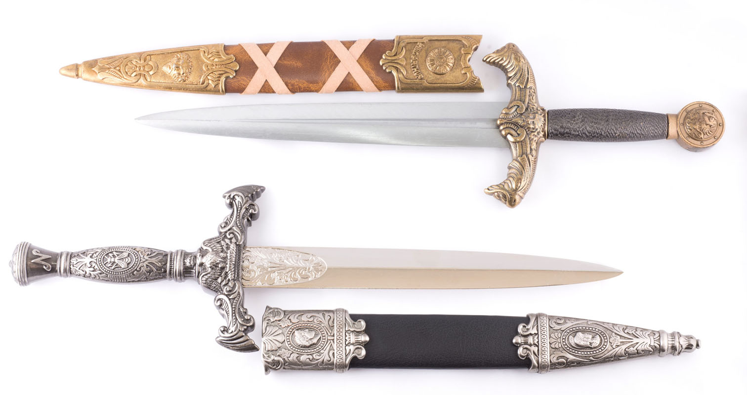 Two hand-forged quillon daggers by Everest Forge, each with a cruciform crossguard, ornate pommel and fitted scabbard, made in Nepal