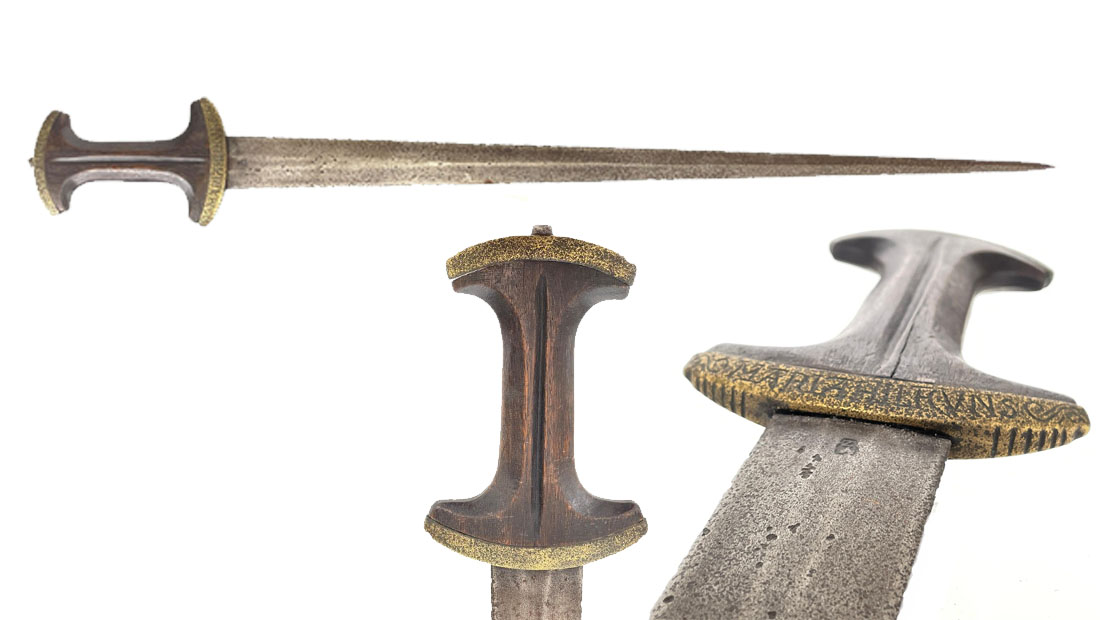 Anatomy of a Degen showing the curved guard, wood grip, capped pommel and thrusting blade