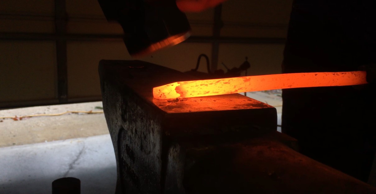 Leaf spring being forged into an edged blade from 5160 carbon steel