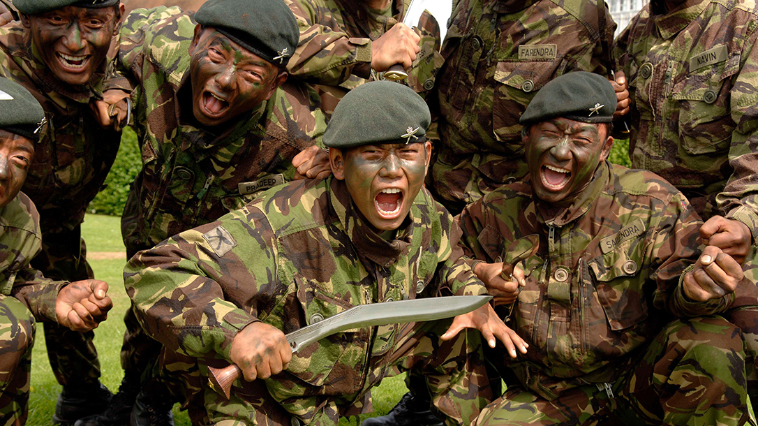 Group of Gurkha soldiers carrying kukri knives