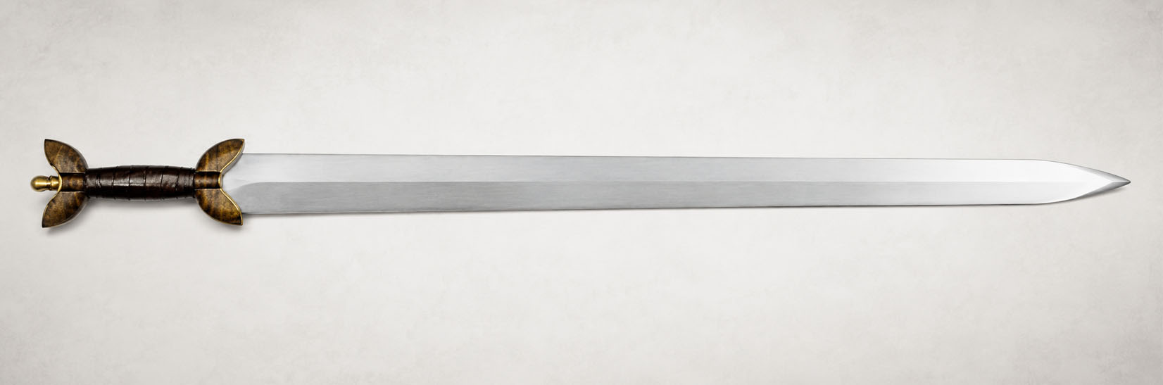Hand-forged Celtic La Tène sword with a brass-guarded rosewood hilt and fan pommel, made by Everest Forge
