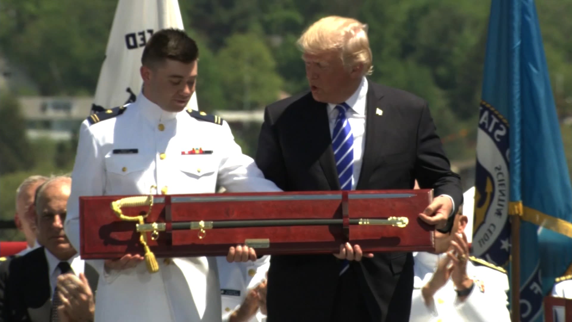 Donald Trump receiving a sword as a gift