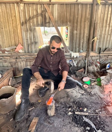 Learning blacksmith forging Nepal