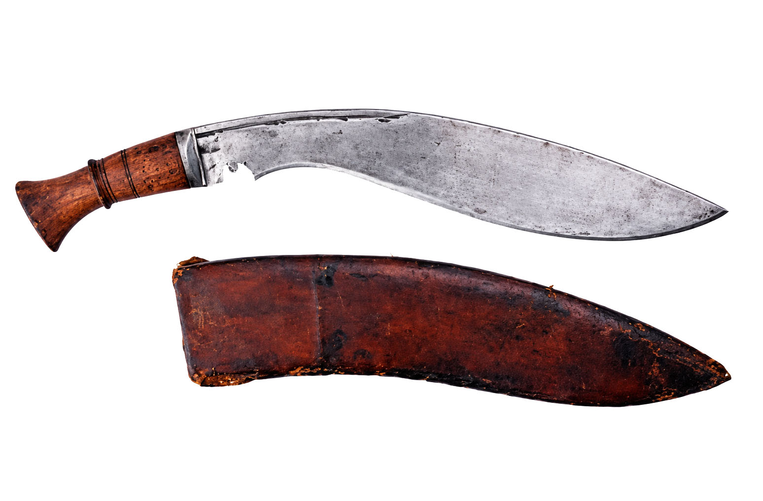 MK I military kukri (khukuri) with one-piece ringed wooden grip, steel bolster and long curved blade, beside its leather scabbard